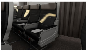 The image shows a row of empty airplane seats in a commercial aircraft. The seats are black with gray headrests and armrests. There is a curtain to the right side of the image, likely separating different classes or sections of the plane. The floor is carpeted, and the seats have tray tables attached to the back. The overall setting appears clean and modern.