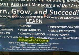 The image shows a job advertisement poster for ABC Stores. The poster highlights various benefits and opportunities for potential employees, including learning opportunities in leadership, buying, profitability, communication, inventory control, problem-solving, and more. It emphasizes "Excellent Benefits, Growth, Expansion, Opportunities" and a "History of NO LAYOFFS." The poster provides contact information for applying, including a phone number and an address in Honolulu, HI. It also mentions that applications can be submitted through their website.