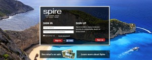 The image shows a scenic coastal landscape with clear blue waters and rocky cliffs. In the foreground, there is a login and sign-up interface for a website called "Spire." The interface includes fields for signing in with a username and password, as well as options to sign up for an account. Below the login interface, there are two buttons labeled "See what's on sale" and "Learn more about Spire." The background image features a beautiful beach with a boat in the water and lush greenery on the cliffs.