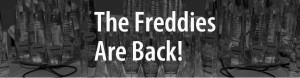 The image shows a collection of trophies with the text "The Freddies Are Back!" written prominently in the center. The trophies are arranged in rows and appear to be awards for an event or competition.