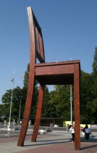 a large wooden chair in a park