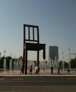 a large chair statue in front of a fountain