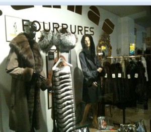 a display of fur coats and coats