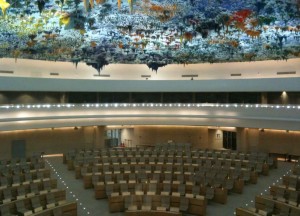 a large room with chairs and a ceiling