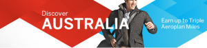 The image is a promotional banner with a man wearing a jacket, smiling, and looking to the side. The background features a red and blue geometric design. The text on the left side reads "Discover AUSTRALIA" and the text on the right side reads "Earn up to Triple Aeroplan Miles."