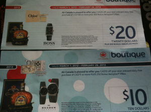 The image shows two Air Canada duty-free shopping vouchers. The top voucher is for $20 and is valid from March 1, 2013, to February 28, 2014, for onboard duty-free purchases of CAD$100 or more. It features images of a Chloe perfume, a bottle of liquor, and a Hugo Boss watch. The bottom voucher is for $10 and is valid from March 1, 2012, to February 28, 2013, for onboard duty-free purchases of CAD$75 or more. It features images of a bottle of liquor and two Skagen watches. Both vouchers also mention bonus Aeroplan Miles.